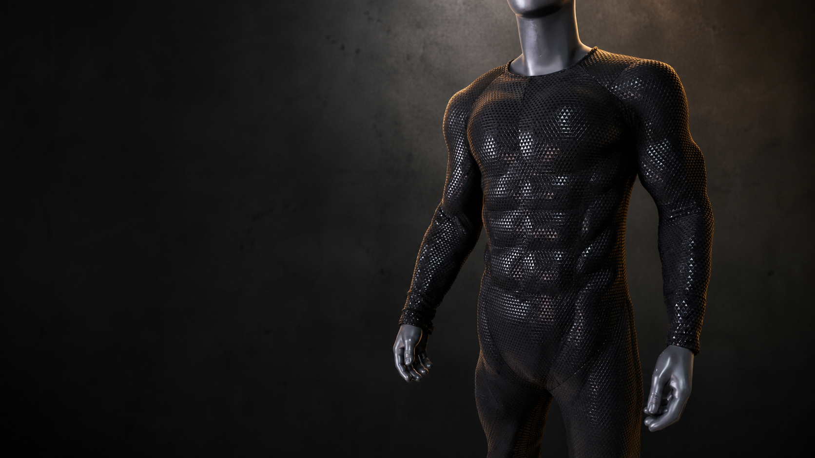 Black 3D padded muscle suit on a mannequin against a dark concrete wall